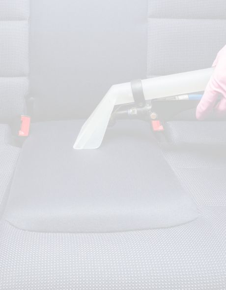 Vacuum cleaning the inside of a car